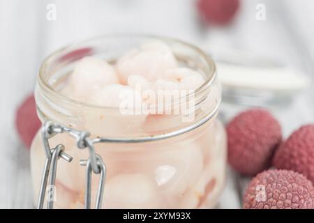 Fresh made Lychees (preserved) on a vintage background (close-up shot) Stock Photo