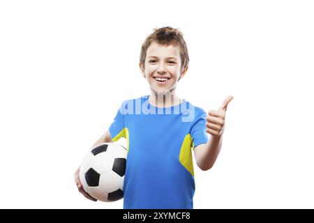 Handsome smiling child boy hand holding soccer ball gesturing thumb up success sign white isolated Stock Photo