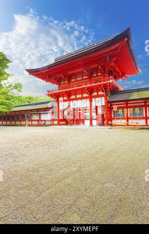 The main front gate to Shimogamo shrine or Kamo Mioya Jinja and entrance door, one of the oldest shinto shrines of Japan on a clear, blue sky day in K Stock Photo