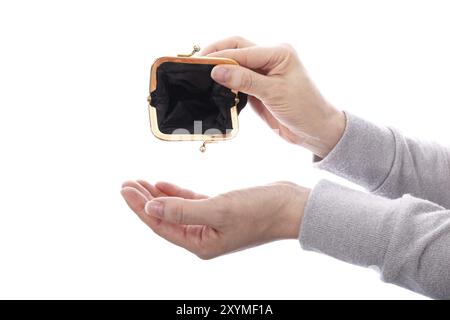 Woman holding open black empty wallet wearing gray clothes isolated over white Stock Photo