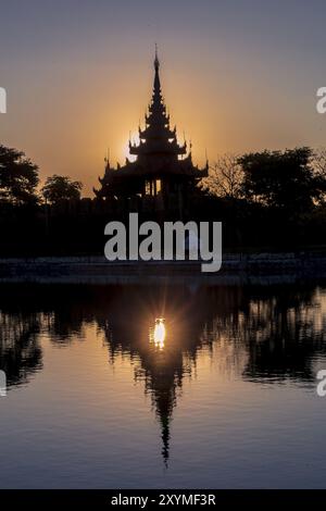 Pagoda silhouette during a sunset in Mandalay, Myanmar (Burma) Stock Photo