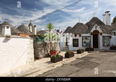 Traditional Trulli houses in Alberobello under a blue sky, Puglia, Italy, Europe Stock Photo