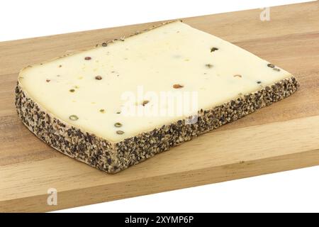 Pepper cheese on a wooden board Stock Photo