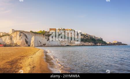 Vieste village view and Pizzomunno rock from the beach, Gargano peninsula, Apulia or Puglia region, Italy, Europe. Stock Photo