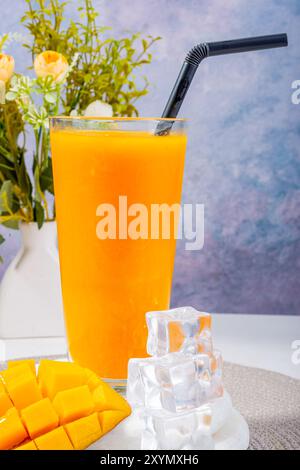 Refreshing Mango Smoothie with Whipped Cream and Ice Cubes Stock Photo