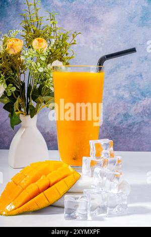 Refreshing Mango Smoothie with Whipped Cream and Ice Cubes Stock Photo