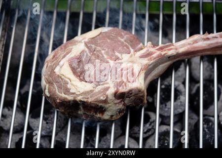 tomahawk steak on the grill Stock Photo