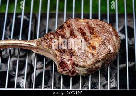tomahawk steak on the grill Stock Photo