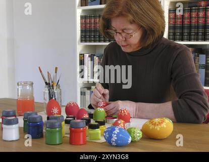 Colouring Easter eggs Stock Photo