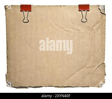 Torn Aged Cardboard With Red Clips Isolated On White Background. Ready for your message Stock Photo