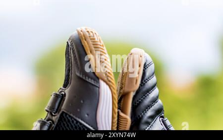 Two kids shoes in different sizes Stock Photo