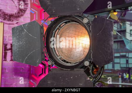 A TV or Movie studio light showing the professional light in low with the barn door flaps open on the lamp Stock Photo