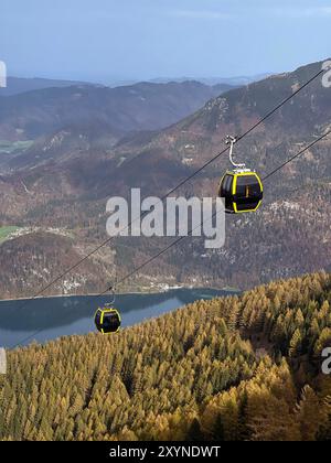 Cable car running from Wolfgangsee lake to the top of the Zwolferhorn mountain. Autumn Alpine landscape in Sankt Gilgen, Austria. Stock Photo