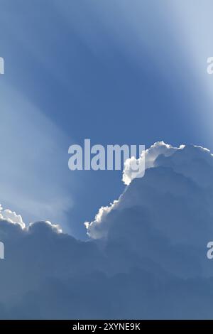 Sunlight shining through layers of clouds Stock Photo