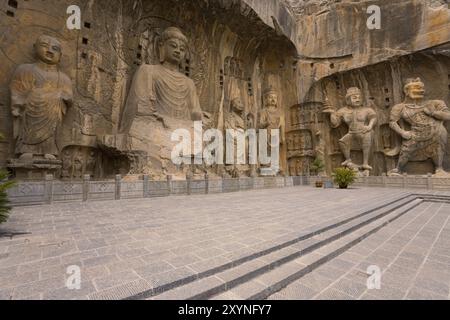 Intricately carved oversized statues at Longmen Grottoes, a UNESCO World Heritage Site in China Stock Photo