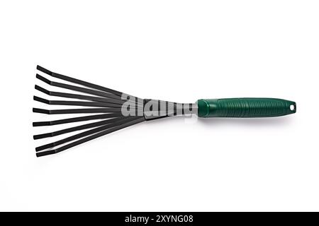 Small garden rake isolated on white background. Gardening tools. Stock Photo