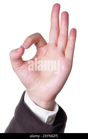 Hand in a suit making the OK sign isolated in white background Stock Photo