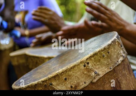 Percussionist playing a rudimentary atabaque during afro-brazilian cultural manifestation Stock Photo