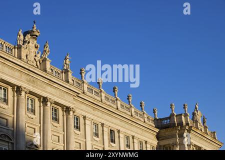 Royal Palace in Madrid, Spain, architectural details, rooftop balustrade with finials and statues, Ionic columns on classical facade, Europe Stock Photo