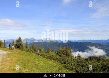 Hiker takes a break in the Dachstein mountains Stock Photo