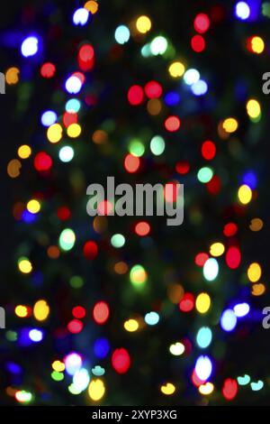 Holiday background from unfocused color lights Stock Photo