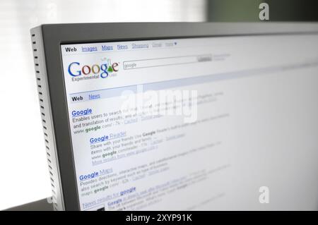 Google search engine page with search results displayed on a computer display Stock Photo