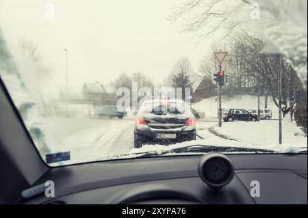 View through the windscreen of a car at a red junction Stock Photo
