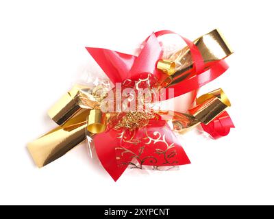 Decorative golden and red bow on a white background, festive holidays decoration Stock Photo