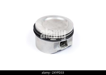 A close-up piston of an internal combustion engine with piston rings isolated on a white background. New spare parts for engine repair Stock Photo