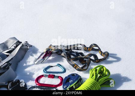 Winter set of equipment of an ice climber with carabiner wounds and a camp thermos. Copy space for the designer Stock Photo