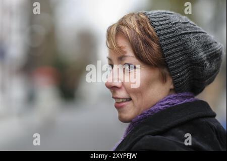 Portrait of a young woman with knitted hat Stock Photo