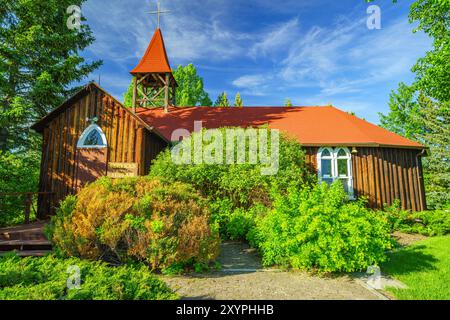 Millarville, Alberta, Canada - June 21 2014: The Christ Anglican Church,better  known as the Cowboy Church.  The log structure was built in 1896. Stock Photo