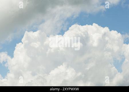 White (cumulus) clouds against the blue sky. The concept of weather Stock Photo