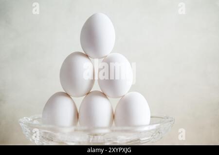 Still life with eggs in a glass bowl Stock Photo