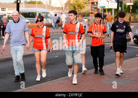 Luton Town supporters before the Sky Bet Championship match at Kenilworth Road, Luton. Picture date: Friday August 30, 2024. Stock Photo