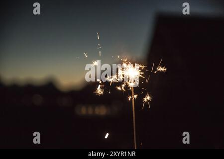 Christmas sparkler on black background. Sparks Stock Photo