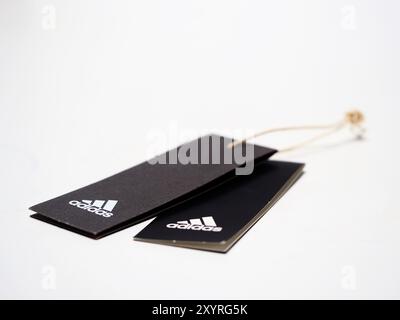 In this photo illustration, the Adidas sportswear labels seen on display. Stock Photo