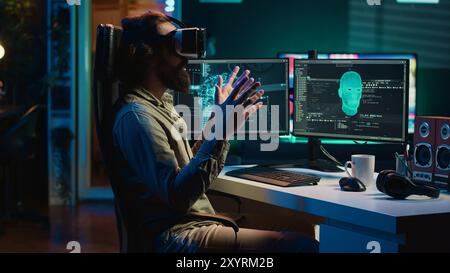 Programmer using VR headset to answer awaken AI gaining consciousness asking existential questions. Developer using virtual reality tech to chat with artificial intelligence, camera A Stock Photo