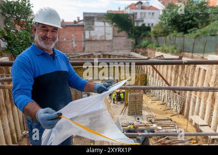 Foreman officer inspector, building Inspector, engineer or inspector at construction site checking and inspecting progressing work in construction sit Stock Photo