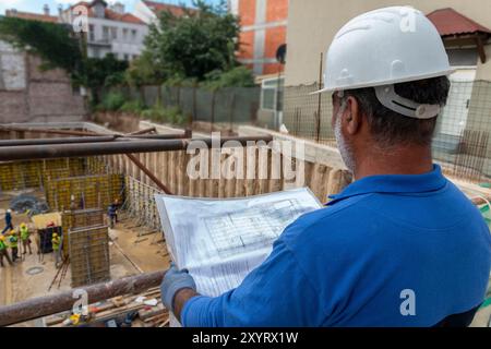 Foreman officer inspector, building Inspector, engineer or inspector at construction site checking and inspecting progressing work in construction sit Stock Photo