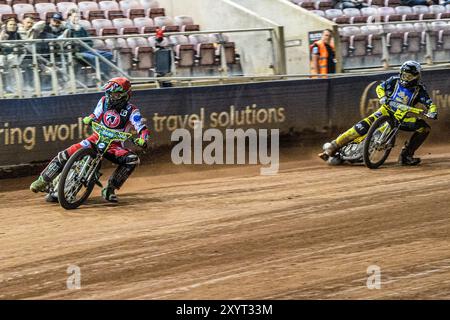 Belle Vue Colts' William Cairns in Red leading Edinburgh Monarchs' Dayle Wood in White during the WSRA National Development League match between Belle Vue Aces and Edinburgh Monarchs at the National Speedway Stadium, Manchester on Friday 30th August 2024. (Photo: Ian Charles | MI News) Credit: MI News & Sport /Alamy Live News Stock Photo