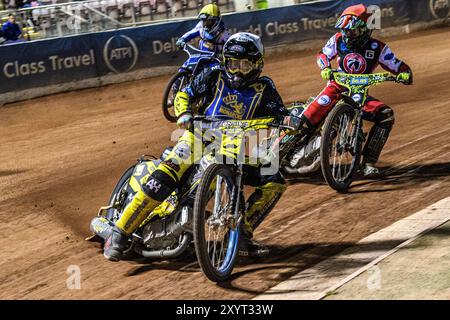 Edinburgh Monarchs' Dayle Wood in White leading Belle Vue Colts' William Cairns in Red and Edinburgh Monarchs' Sam McGurk in Yellow during the WSRA National Development League match between Belle Vue Aces and Edinburgh Monarchs at the National Speedway Stadium, Manchester on Friday 30th August 2024. (Photo: Ian Charles | MI News) Credit: MI News & Sport /Alamy Live News Stock Photo