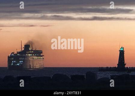 Ludington, Michigan, USA. 30th Aug, 2024. The SS Badger car ferry, the last coal-powered steamship in the United States, leaves port in Ludington, Michigan Friday evening August 30, 2024, headed across the lake for Manitowoc, Wisconsin. It has been in service since 1953 and makes one crossing each way daily. (Credit Image: © Mark Hertzberg/ZUMA Press Wire) EDITORIAL USAGE ONLY! Not for Commercial USAGE! Stock Photo