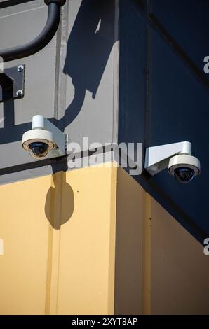 Security Cameras Mounted on Building Corner – Surveillance and Safety Stock Photo