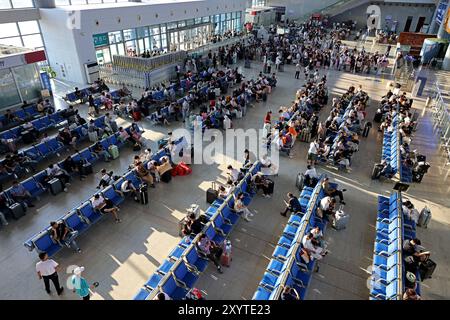 ZAOZHUANG, CHINA - AUGUST 31, 2024 - Passengers wait at the waiting room of Zaozhuang Station on the Beijing-Shanghai high-speed Railway in East China Stock Photo