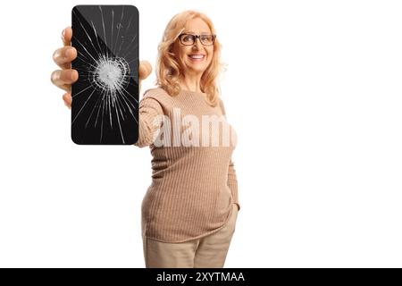 Woman holding a smartphone with cracked screen glass isolated on white background Stock Photo