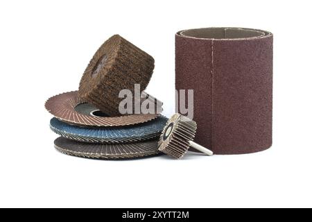 Flap discs for angle grinders, abrasive cloth flap wheels and flap brush wheels for use in drill and sandpaper in close-up view isolated on white back Stock Photo