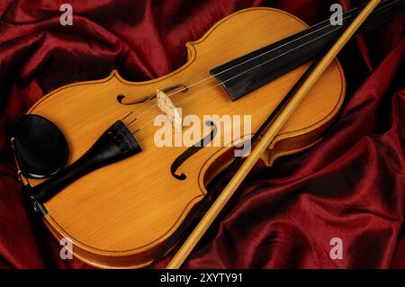 Violin on red background musical still life Stock Photo