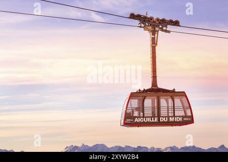 Chamonix Mont Blanc, France, January, 28, 2015: Cable Car cabin at Aiguille du Midi and pink sunset sky, French Alps, Europe Stock Photo