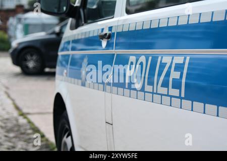 Parked police car during a police operation Stock Photo